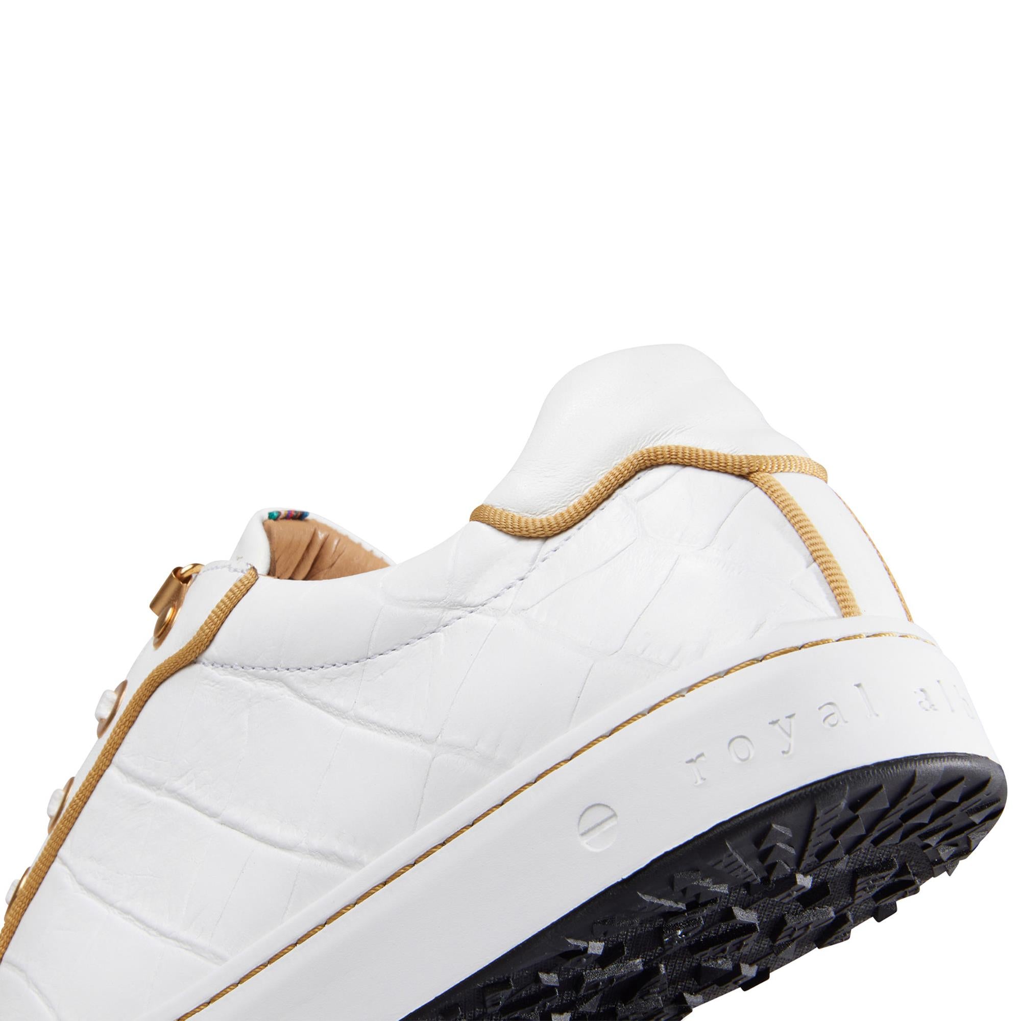 Close-up of golf detail on the back of Royal Albartross Buckingham white and gold ladies golf shoes – premium womens golf footwear with elegant branding