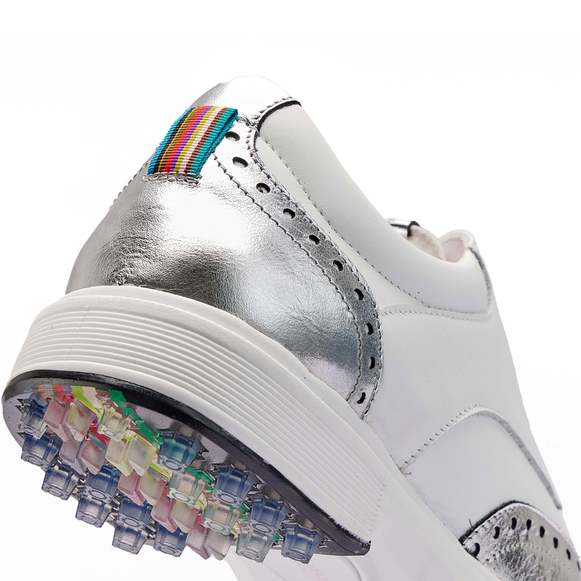  Close-up of the back heel detail on Royal Albartross Tailor Wingtip Brogue golf shoes in white and silver – elegant finishing on luxury golf shoes for women
