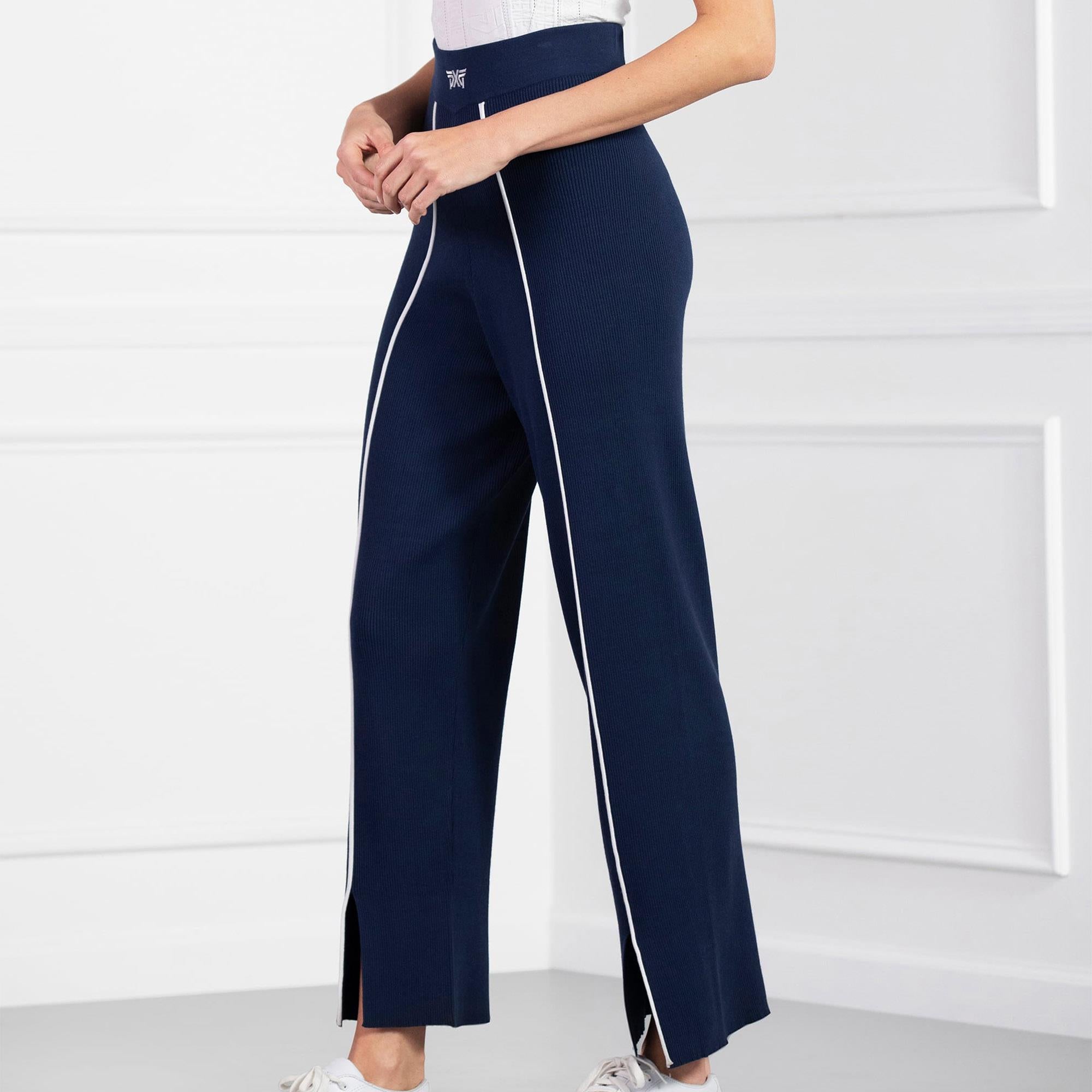 Side angle of model in PXG Contrast Seam Ladies Golf Pants, navy