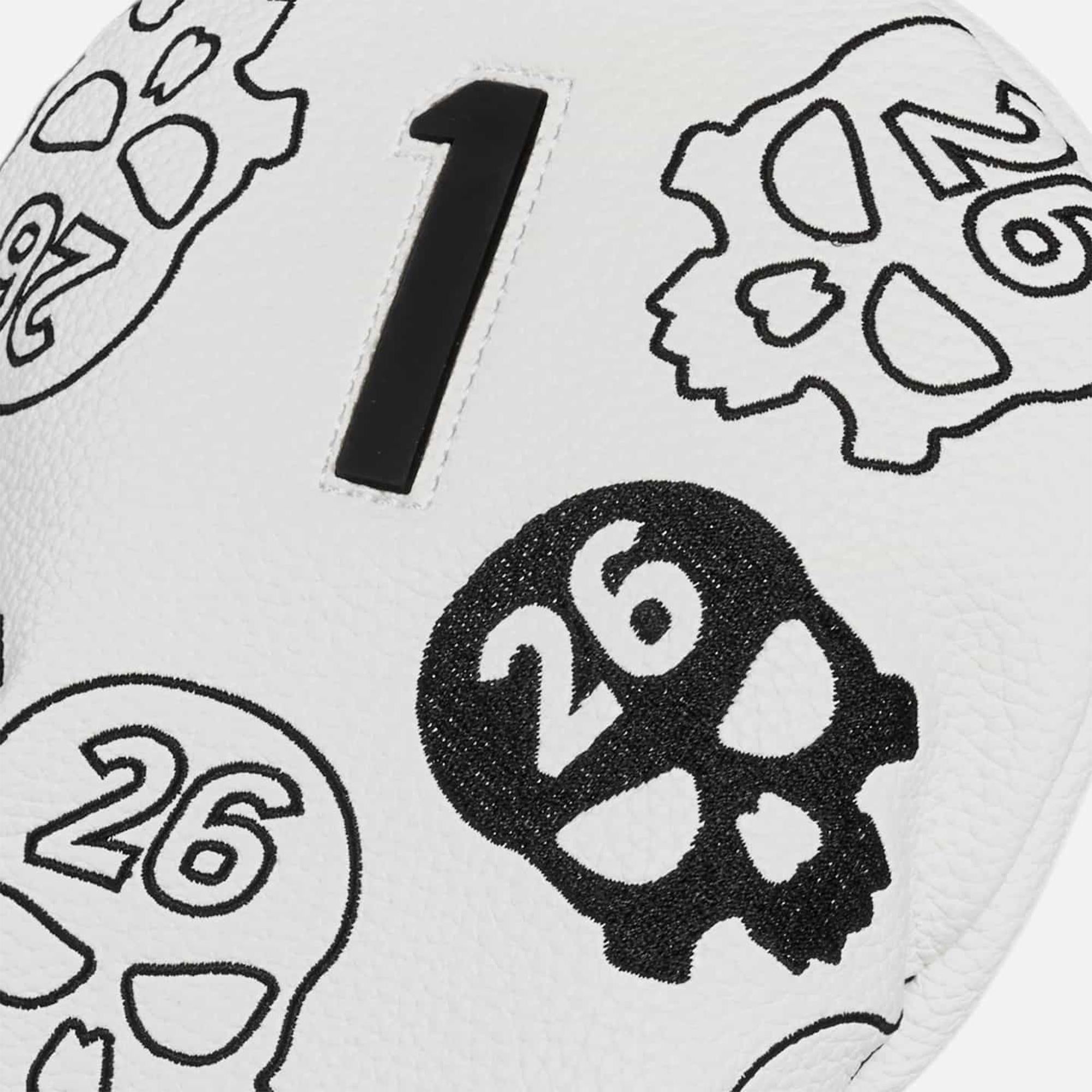 Close-up of PXG logo on Darkness Driver Headcover white and black